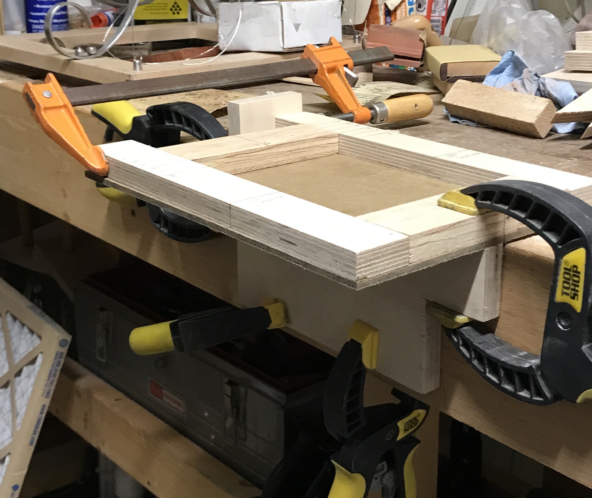 The jig clamped to the workbench